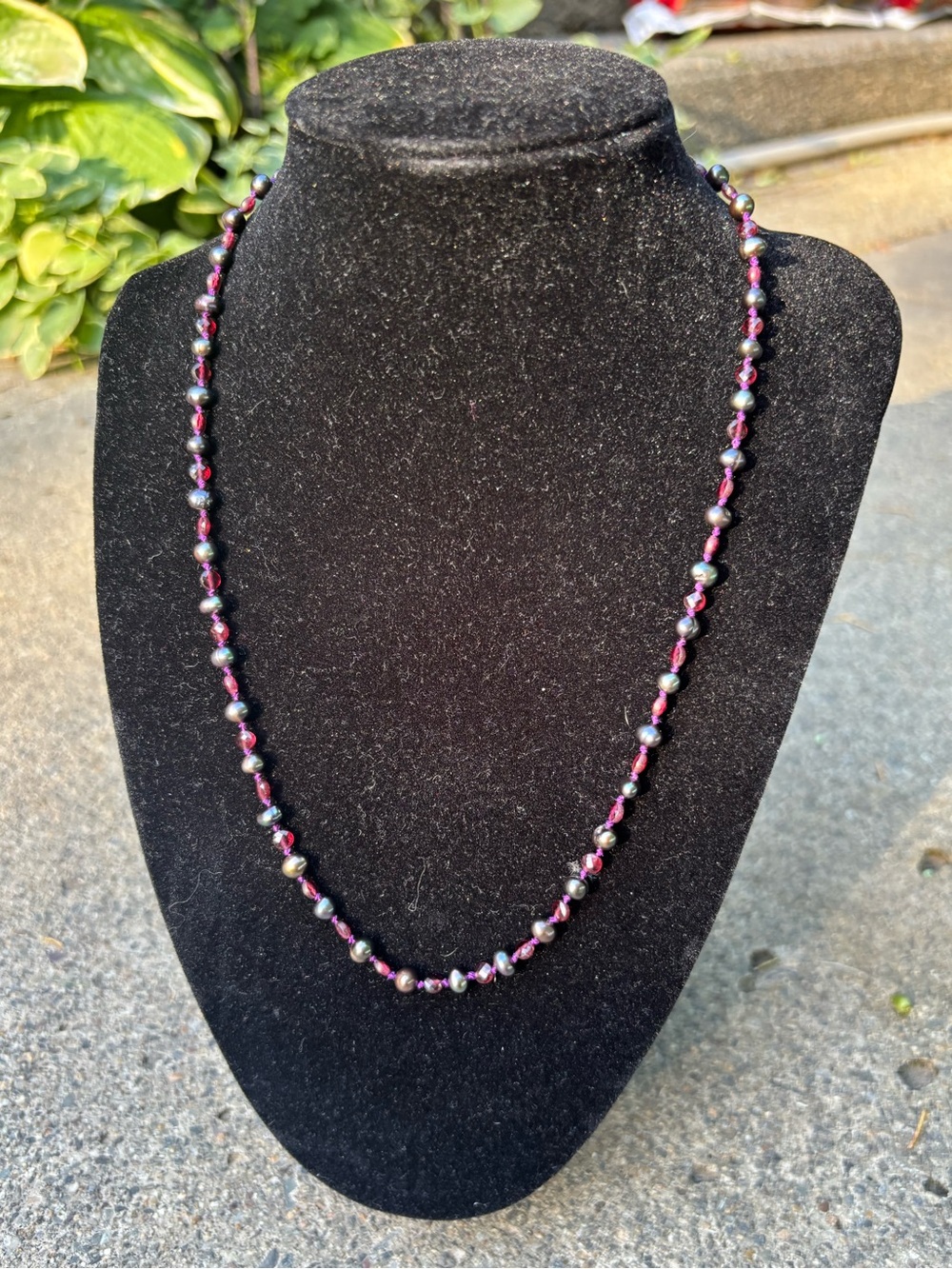 Real peacock pearl garnet necklace.